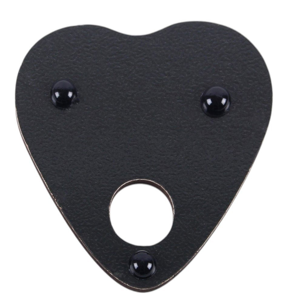 Black leather patch with heart shape and central circular cutout on a white background