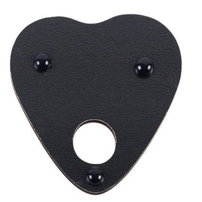 Black leather patch with heart shape and central circular cutout on a white background